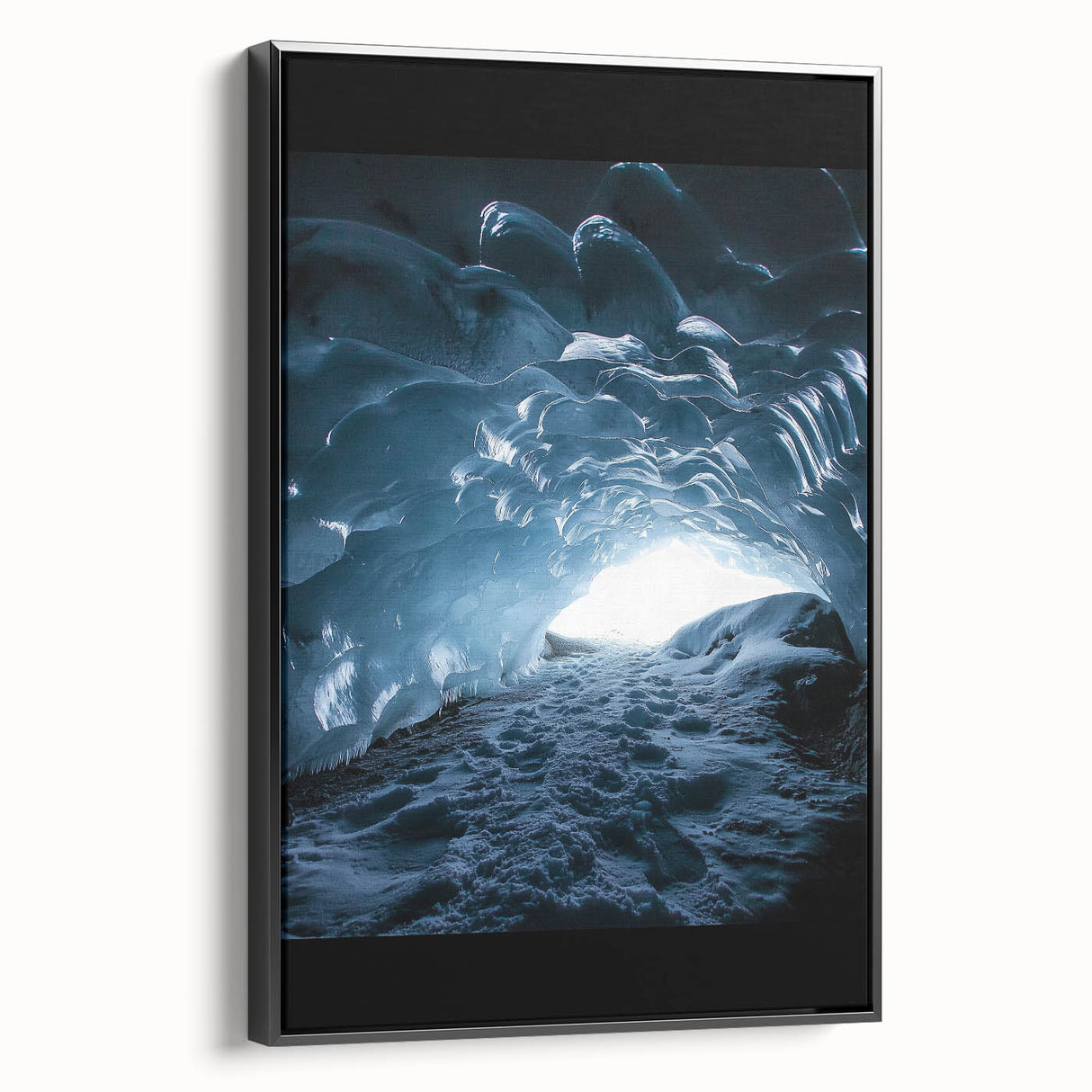 Framed canvas artwork showcasing a stunning cave landscape, featuring rich earthy tones and intricate details, presented in a sleek black frame, ideal for home decor.