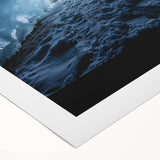 Rolled canvas artwork depicting a stunning landscape with intricate cave formations, featuring vibrant colors and textures, securely packaged in a protective tube for delivery.