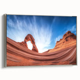 Framed landscape canvas depicting vibrant canyons in rich earth tones, featuring a sleek silver frame, ideal for enhancing modern home decor.