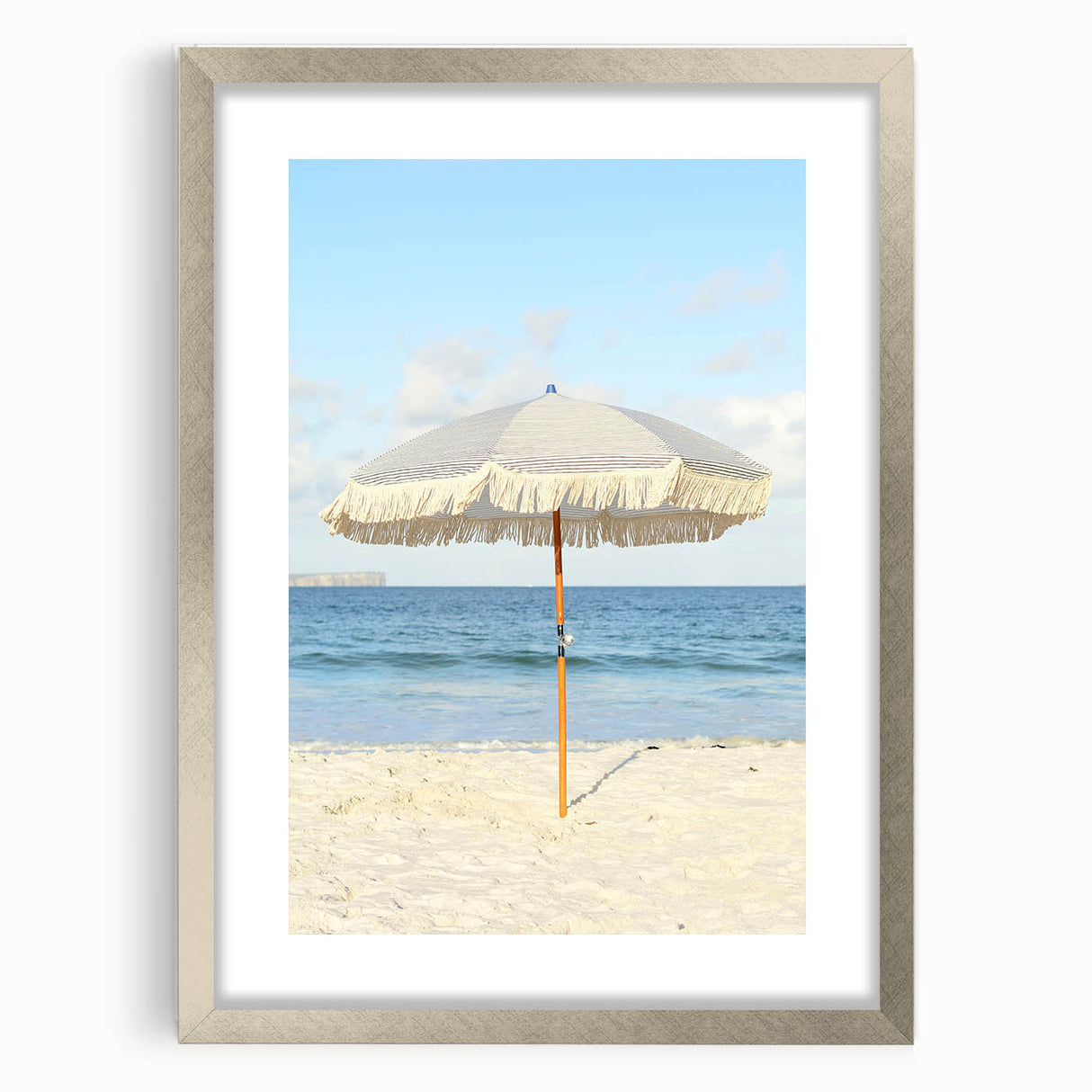 Textured abstract art print in silver frame, featuring soft gray and white swirls, suitable for modern bedroom ambiance.