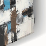 Close-up of an abstract acrylic glass artwork showcasing vibrant strokes in shades of blue, green, and gold, perfect for modern home decor accents.