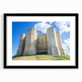 Framed landscape artwork showcasing a picturesque castle scene, elegantly matted in black, ideal for enhancing home decor aesthetics and artistic ambiance.