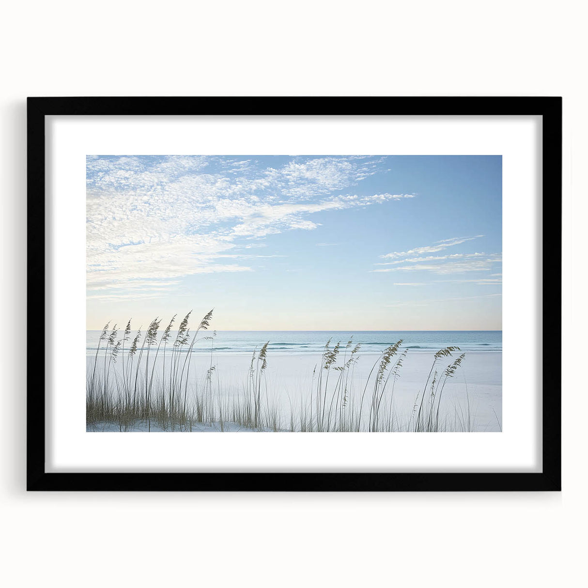 Black-framed landscape artwork showcasing a serene beach scene with soft waves and a clear sky, featuring a white mat for an elegant presentation, perfect for home decor.