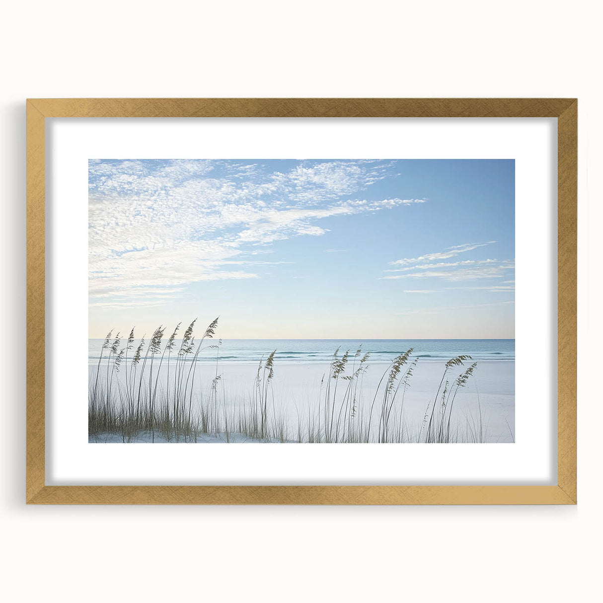 Elegant gold-framed landscape artwork depicting serene beaches with soft waves and a clear sky, perfect for enhancing home decor with a coastal theme.