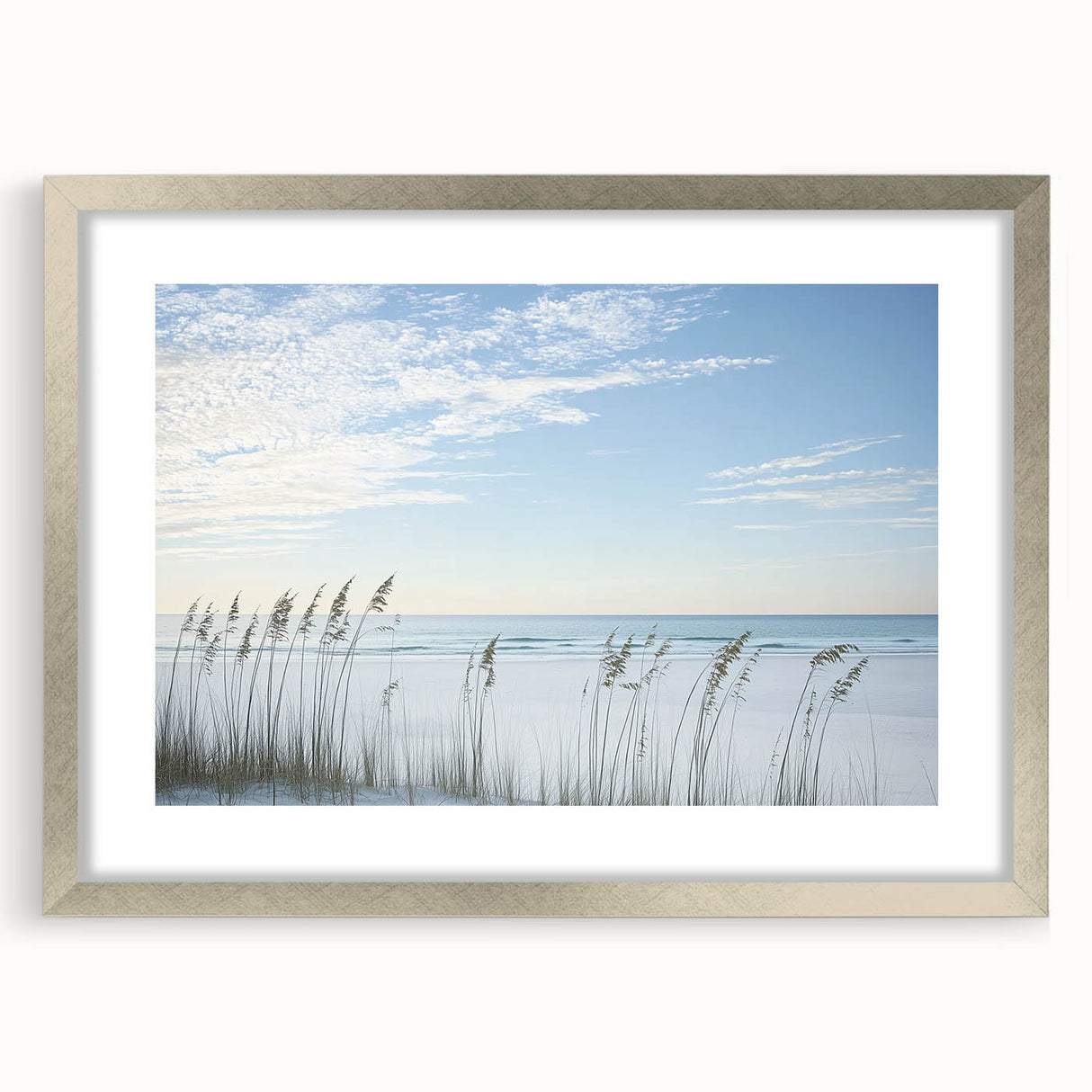Elegant silver-framed landscape artwork of serene beaches, showcasing gentle waves and golden sands, perfect for enhancing coastal-themed decor in any room.