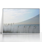 Framed acrylic artwork depicting a serene beach landscape with vibrant colors and soft waves, set in a sleek white frame, perfect for coastal decor enthusiasts.