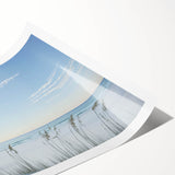 Rolled landscape print depicting a serene beach scene with vibrant blue skies and soft sandy shores, elegantly packaged in a protective cardboard tube.