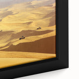 Close-up of a framed canvas artwork depicting a vibrant desert landscape with golden sand dunes under a clear blue sky, showcasing intricate details and textures.