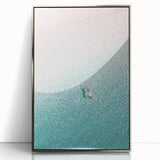 Mid-century modernist art featuring geometric shapes in blue and orange tones on a silver framed acrylic print.