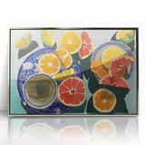 Mid-century modernist art featuring an array of fruits in vibrant colors on a silver-framed acrylic.