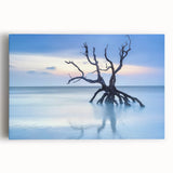 Stretched canvas artwork depicting a serene beach landscape with soft waves and vibrant sunset colors, ideal for coastal home decor and relaxation themes.