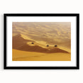 Black-framed landscape artwork showcasing a serene desert scene with vibrant colors and intricate details, perfect for home decor or office spaces.