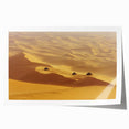 Desert landscape rolled canvas print showcasing vibrant, warm hues of orange and yellow sand dunes under a clear blue sky, elegantly packaged for art enthusiasts.