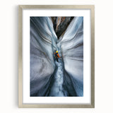 Framed landscape cave artwork with a silver mat, showcasing intricate textures and vibrant colors, perfect for enhancing home decor in modern settings.