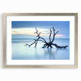 Framed landscape artwork depicting serene beaches, featuring a silver mat and elegant frame, ideal for enhancing modern home decor. Perfect for beach lovers.