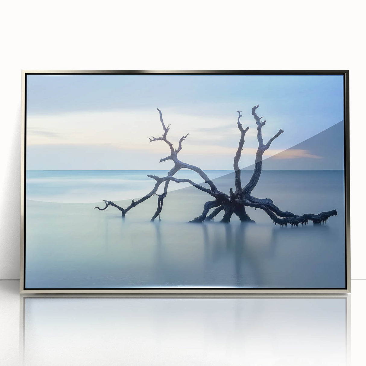 Framed acrylic artwork depicting a serene beach landscape, showcasing vibrant blues and soft sandy tones, perfect for coastal home decor.