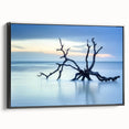 Framed canvas artwork depicting a serene beach landscape with vibrant colors and detailed textures, showcased in a sleek black frame, perfect for home decor.