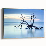 Framed canvas artwork depicting a serene beach landscape, showcasing vibrant colors and intricate details, accented with a sleek silver frame for modern decor.
