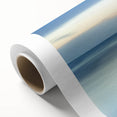 Vibrant rolled canvas showcasing a serene beach landscape with soft waves and golden sand, elegantly packaged in a protective cardboard tube, ideal for home decor.