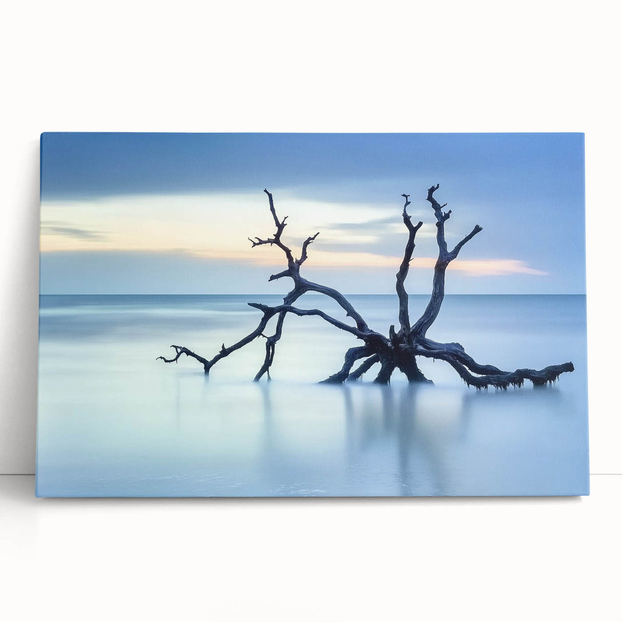 Stretched canvas artwork depicting a serene beach landscape with soft pastel colors, ideal for coastal home decor, showcasing tranquil waves and a clear sky.