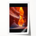 Vibrant rolled print of a desert landscape showcasing warm tones of orange and yellow sand dunes under a clear blue sky, ideal for home decor.