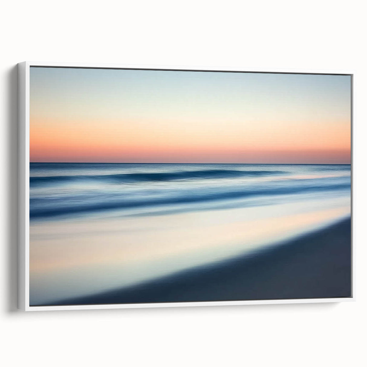Framed landscape canvas art depicting serene beaches with soft waves and a clear blue sky, showcasing a white frame from a side view, perfect for home decor.