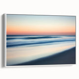 Framed landscape canvas art depicting serene beaches with soft waves and a clear blue sky, showcasing a white frame from a side view, perfect for home decor.