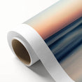 Vibrant rolled canvas print showcasing a serene beach landscape with soft waves and golden sands, elegantly packaged in a protective cardboard tube for safe delivery.