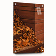 Large abstract wall art featuring swirling orange and brown hues on acrylic glass, suitable for bedroom or dining room decor.