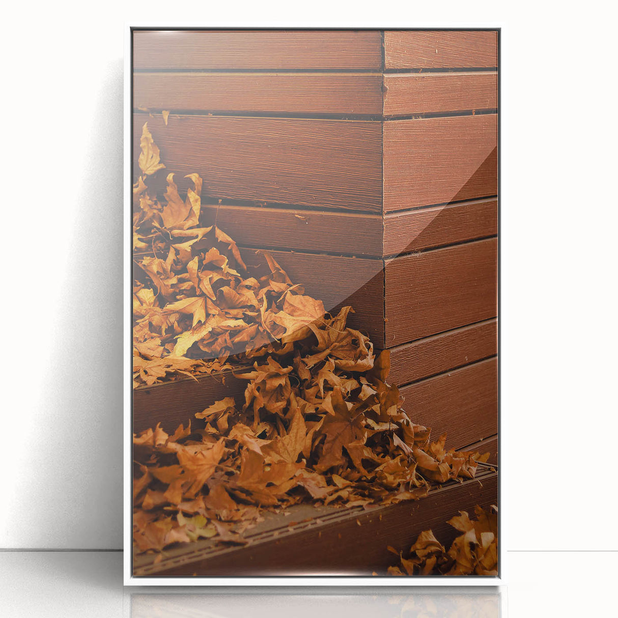 Art deco poster featuring a stylized fall scene in orange and brown tones, framed in white acrylic.