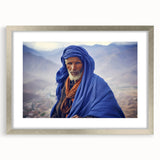 Abstract art print featuring a stylized African landscape in earthy tones on a silver-framed mat.