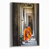Framed canvas featuring a vintage-style landscape painting of a Cambodian scenery, with vibrant colors on a black background.