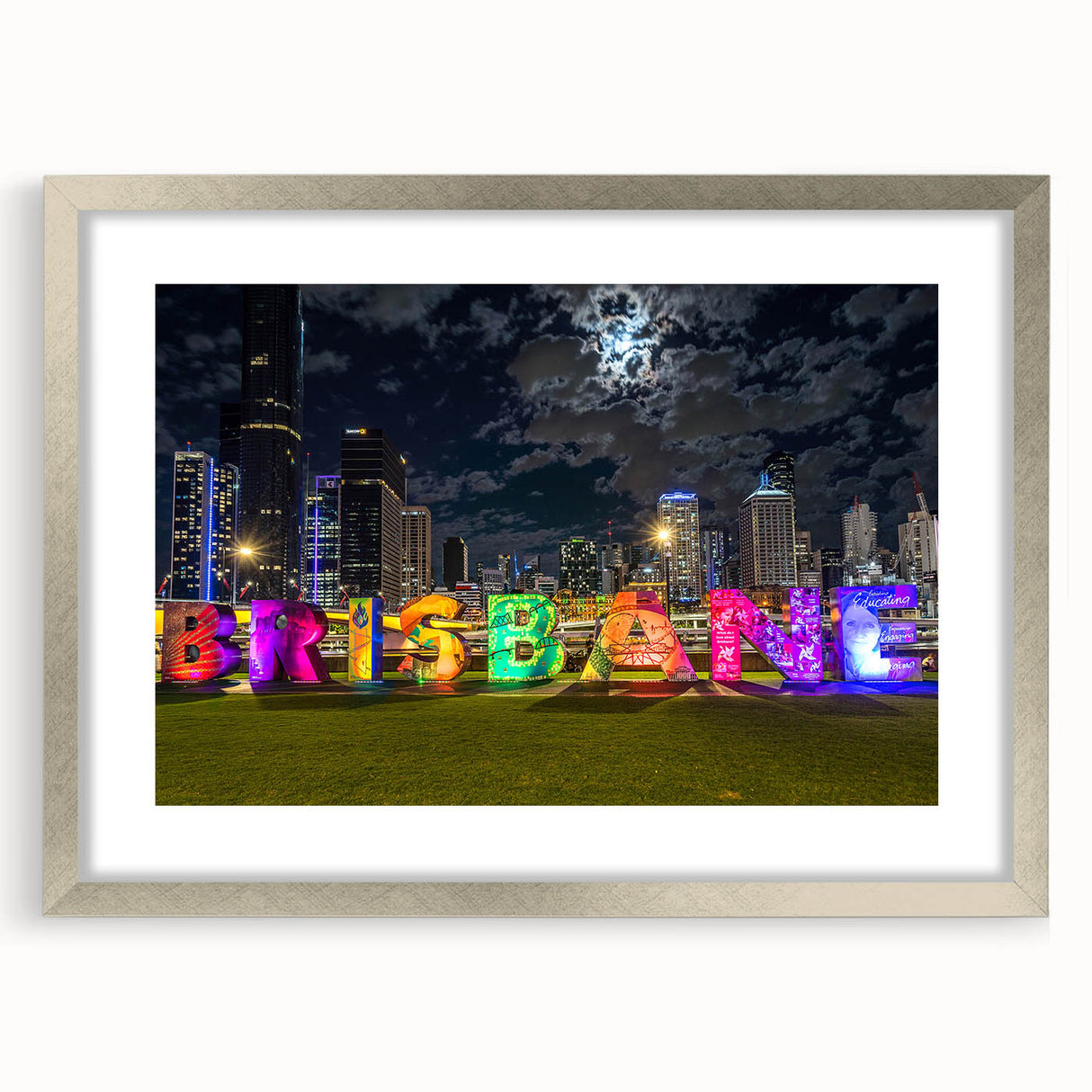 Abstract art print of Brisbane skyline in muted blue and gray, framed in silver, suitable for dining room decor.