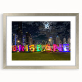 Abstract art print of Brisbane skyline in muted blue and gray, framed in silver, suitable for dining room decor.