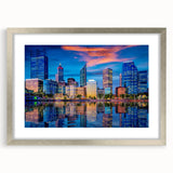 Abstract art print of Perth skyline in muted gray and blue tones on a framed silver mat, ideal for dining room decor.