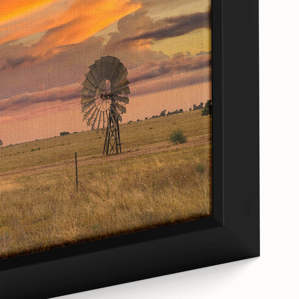 Close-up of a textured black wall art depicting Queensland scenery on a framed canvas, featuring vibrant colors.