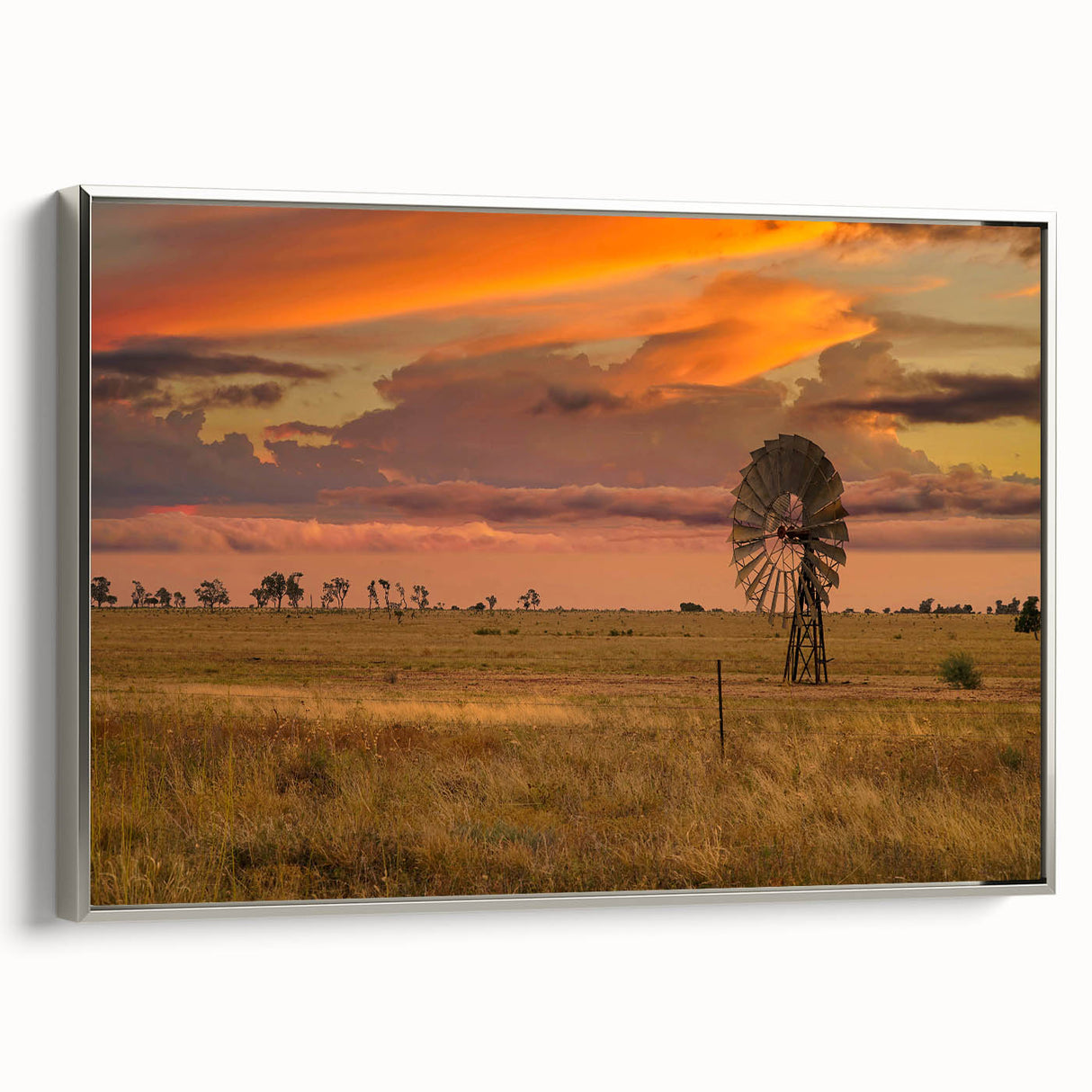 Landscape art painting of Queensland scenery on framed canvas, featuring a silver frame and vibrant color palette.