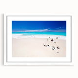 Textured abstract art print depicting Caribbean scenery in vibrant blue and green tones, framed with a white mat.