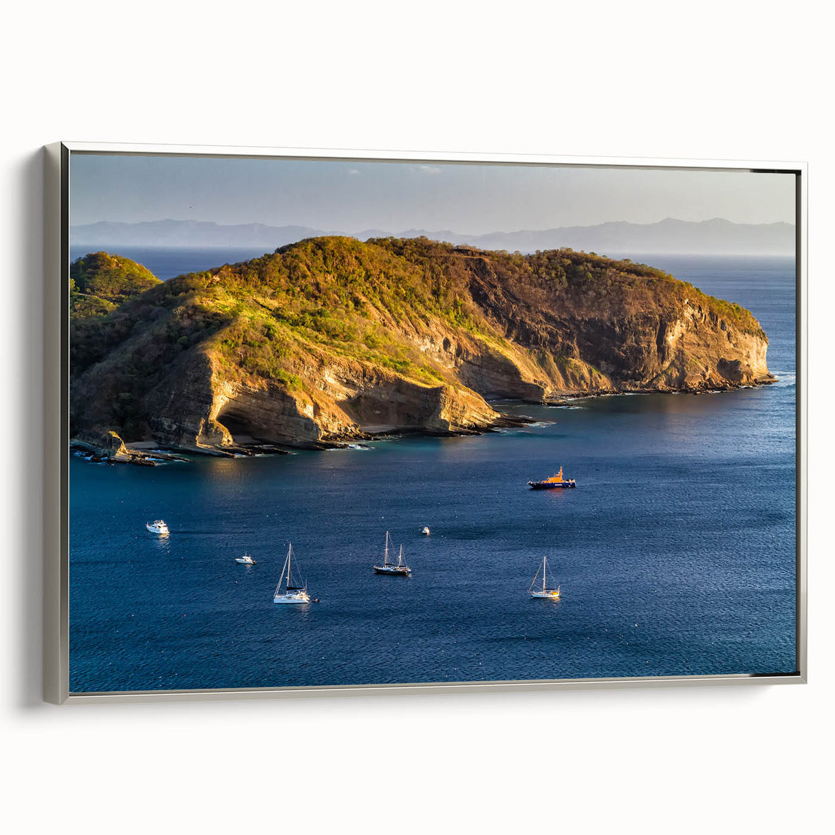 Vintage landscape art painting of a Nicaraguan scenery, framed in silver, featuring colorful art on a black background.