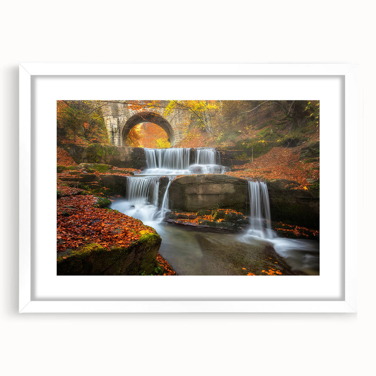 Textured abstract art print of a European scenery in muted earth tones, framed with a white mat, suitable for bedroom decor.