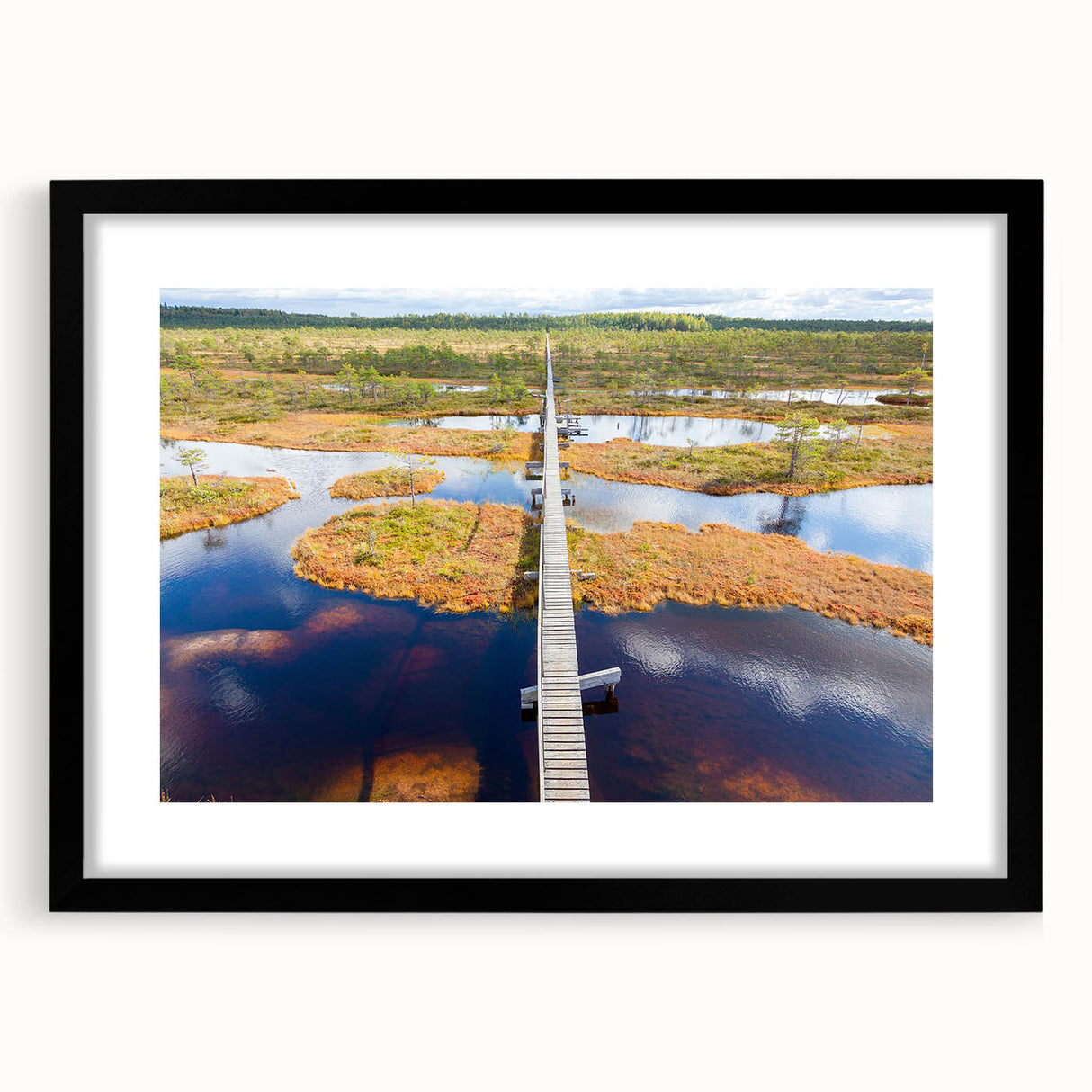 Colorful abstract art print of a European scenery in vibrant hues on a large textured canvas, framed in black.