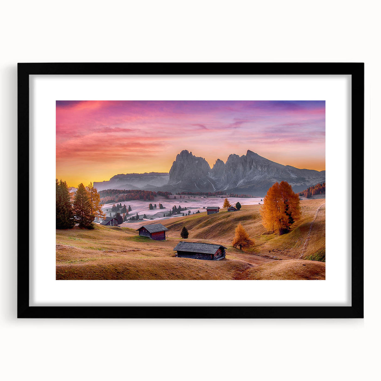 Colorful abstract art print of the Dolomites in Italy, presented in a black frame with mat, ideal for living room decor.