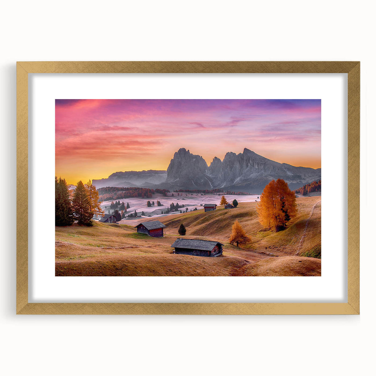 Abstract art print of the Dolomites in muted earth tones on a gold-framed mat, suitable for dining room decor.