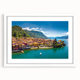 Textured abstract art print of Lake Como with muted blue and green hues, framed with a white mat, ideal for bedroom art.