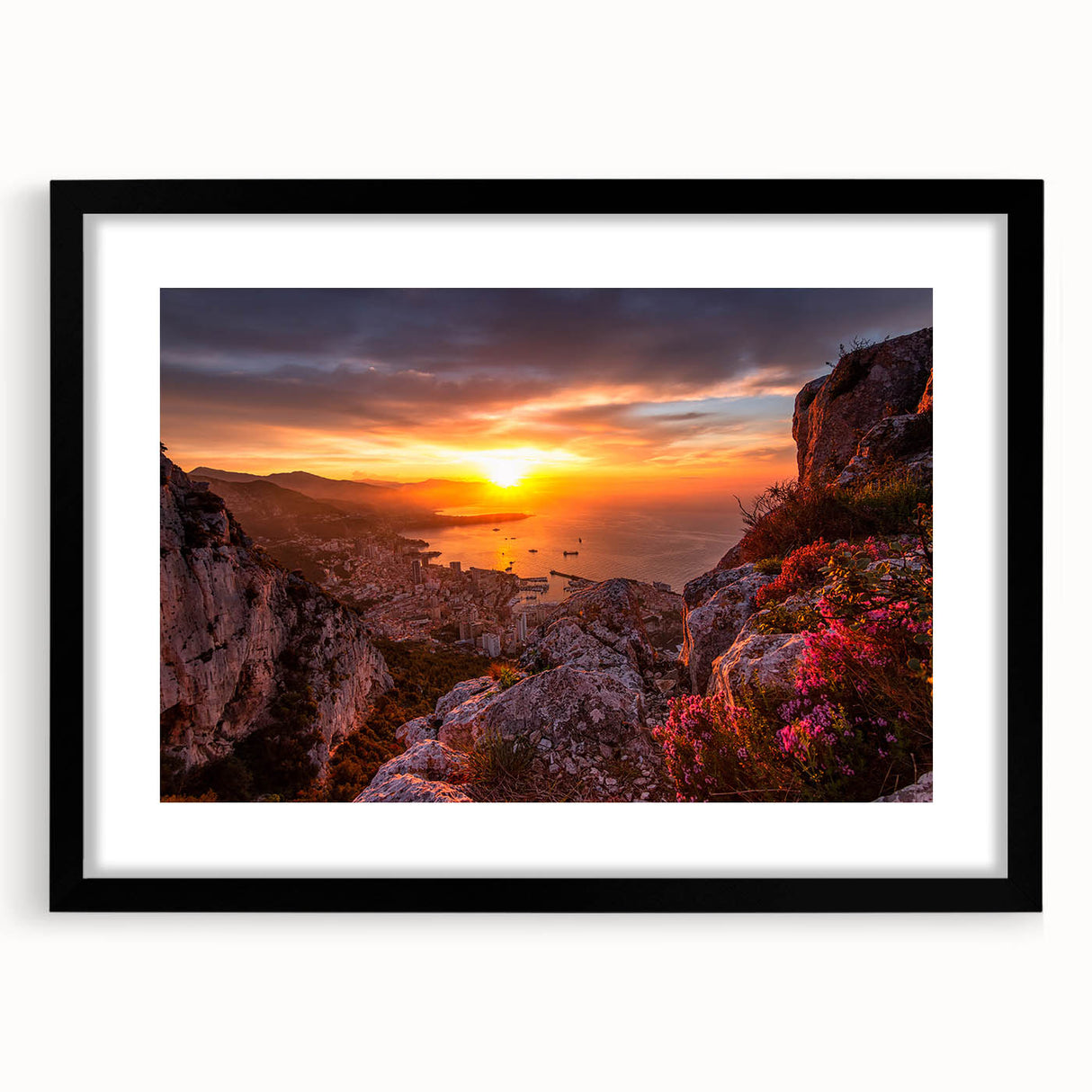 Colorful abstract art print of a European Monaco scenery in vibrant hues on a large framed black mat.