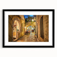 Extra large abstract art print depicting a vibrant, colorful European scenery on textured canvas, framed in black.