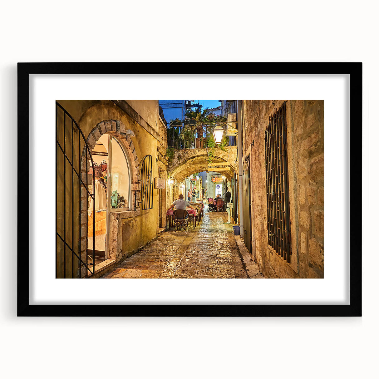 Extra large abstract art print depicting a vibrant, colorful European scenery on textured canvas, framed in black.