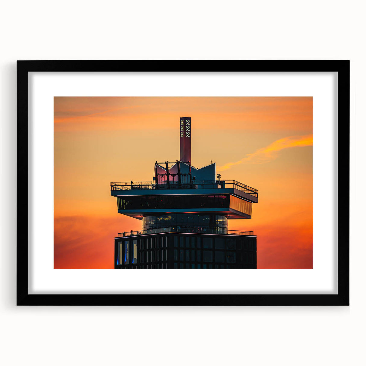 Colorful abstract art print of Amsterdam scenery in vibrant hues, framed in black, ideal for living room decor.