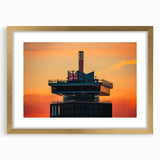 Abstract art print of Amsterdam scenery in muted gold and blue tones, framed with a mat, suitable for dining room decor.