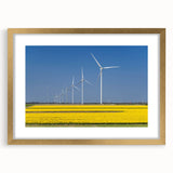 Abstract art print of a European scenery in muted earth tones on a gold-framed mat, suitable for dining room decor.